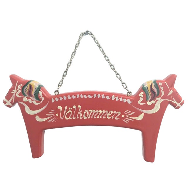 Offered is a traditional Swedish folk-art Dala horse figurine welcome sign (that reads: "Välkommen") of whittled wood and...