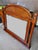 Solid wood, very well built. Nice bevel edge glass with no scratches or nicks on glass. I do not know the manufacturer....