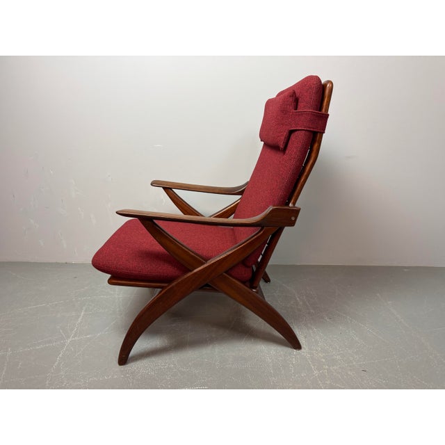 High-quality Mid-Century Dutch lounge chair attributed to Topform. Featuring a solid teak wood frame and newly upholstered...