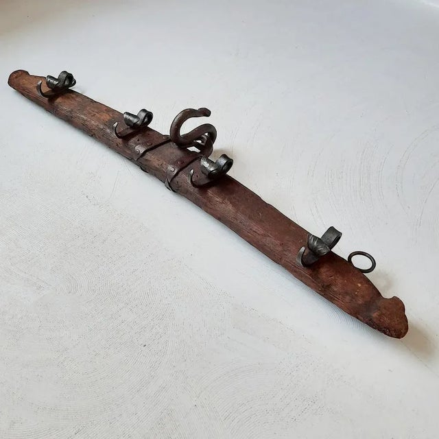 This antique yoke (likely 19th century, but might be older) was long ago transformed into a coat rack or pot rack by...