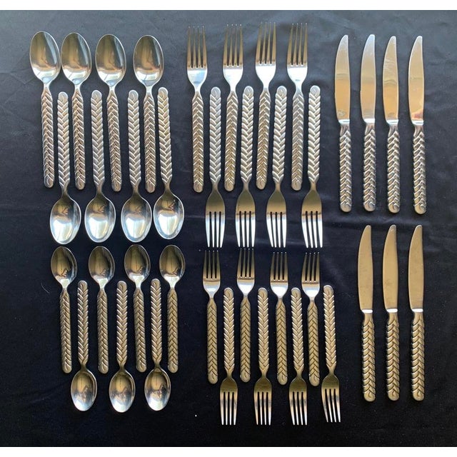 38 pcs of Cambridge Silver "Candellabra" Flatware. The handle is woven similar to the Ralph Lauren "Equestrian" flatware....