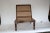 Teak wood chair with ratan back and seat. Low chair with wide seat.