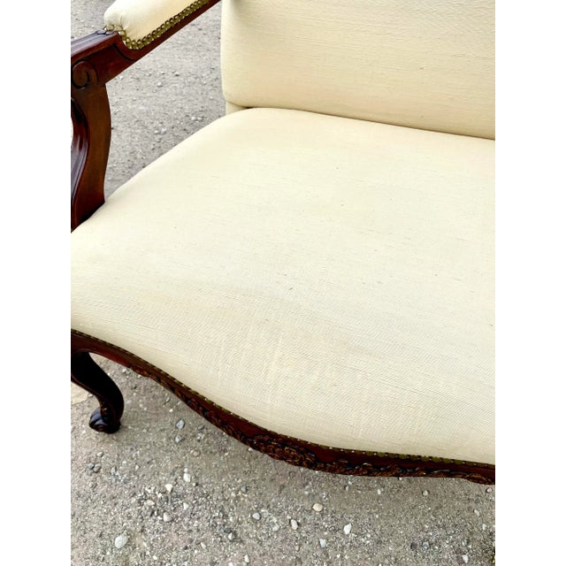 A pair of large Louis XV chairs from luxury furniture maker Dennis and Leen designed for William Switzer. Generously...