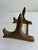 Charming vintage gold painted wood plate stand featuring elegant curved and scrolled details. Ideal for showcasing...