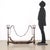 Wrought iron fireplace andiron. This piece is attributed to the mentioned designer/maker. It has no attribution mark and...