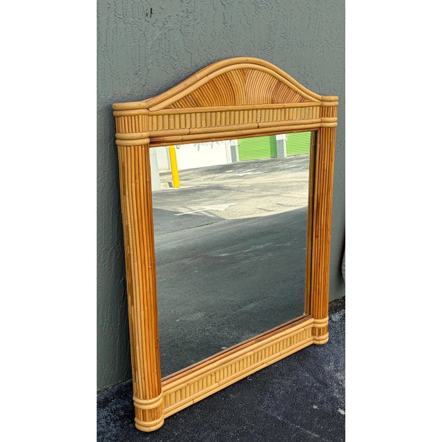 This is a large all pencil reed wall mirror. The mirror sits features side columns. This has great size and it would be...