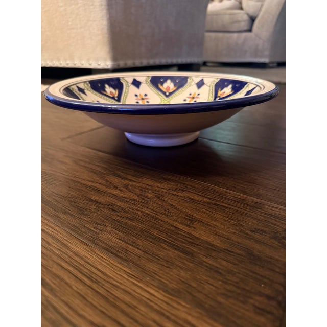 Bring Mediterranean warmth to your tabletop or wall display with this striking, authentic Tunisian tebsi pedestal bowl....