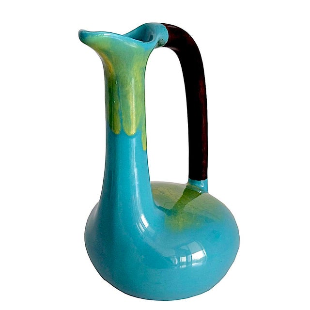 Offered is a mid 20th Century glazed ceramic decorative "Bird" pitcher/decanter/vase designed by Edmund Ronaky for Jaru...