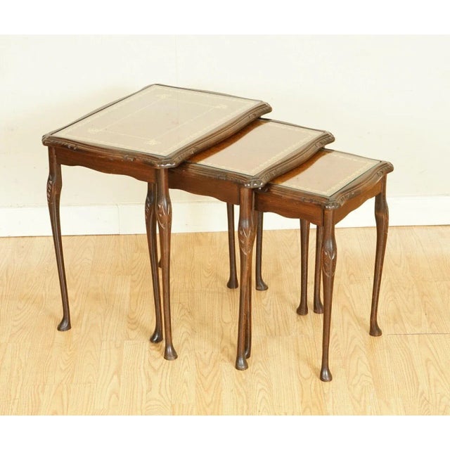 We are so excited to present to you this Outstanding Nest of Tables with Brown Leather. All tables have a glass top to...