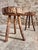 Set of two vintage wooden stools originating from France and dating from approximately the 1960s. The stools feature thick...