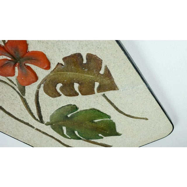 Large wall ceramic from Krösselbach from the 50s with floral motif typical of the time. Made of plaster and ceramic, edged...