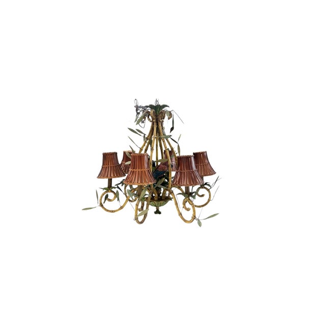 Lofty six light Italian mid century chandelier crafted in a mix of composition and tole having a faux bamboo frame and six...