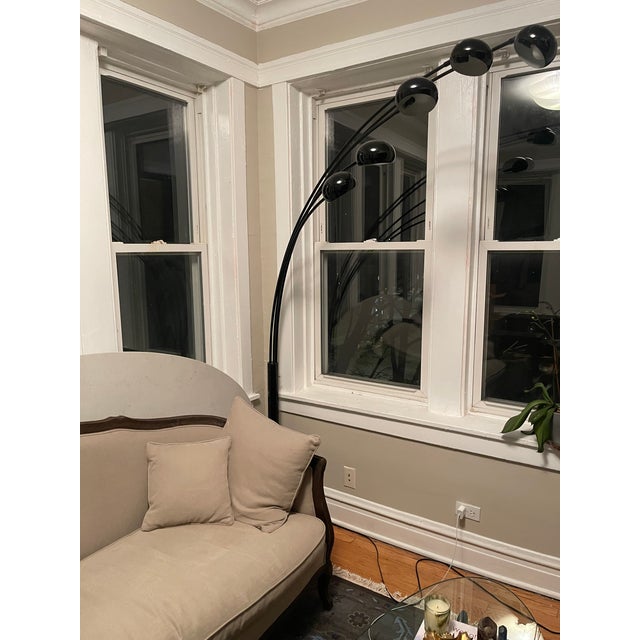 Arc floor lamp from Sweden made of a round Carrara marble base, black metal central stem, and five adjustable arms of...