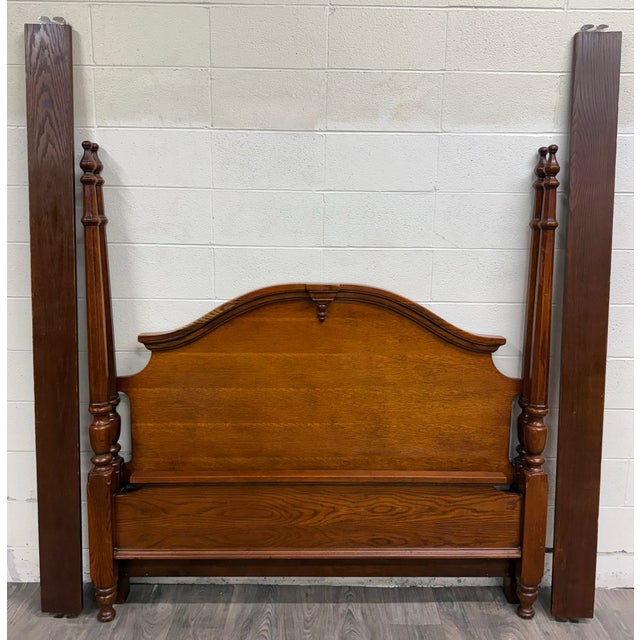 This is a beautiful vintage Colonial Revival convertible Queen or Full sized four poster bed in oak with tall turned...
