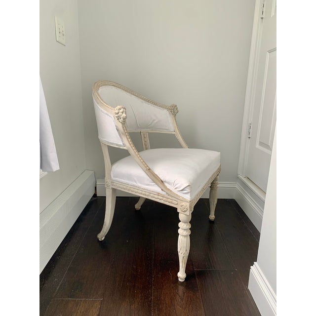 Swedish neoclassical chair attributed to Ephraim Stahl. A graceful siluette with hand carved lion heads and finished in a...