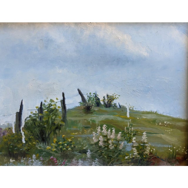 Up Hill depicts a serene landscape characterized by gentle rolling hills adorned with lush greenery and vibrant...