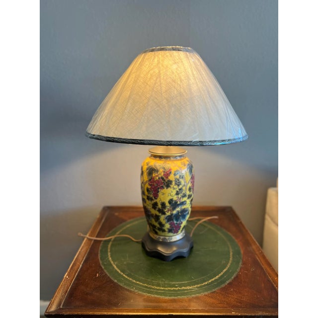 A hand-painted vintage chinoiserie table lamp. Lovely gold leaf accents with vivid yellow background, grapes with leaves....