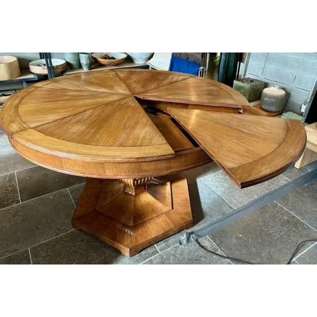 Dining table with fold-out leaves atop a faceted pedestal with a hexagonal base. Material: Walnut Finish: Medium Walnut...