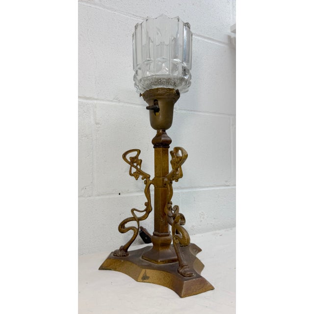 This antique ornate early 1900's Art Nouveau electric table lamp is a true eye catcher. Made of bronze with an Art Nouveau...