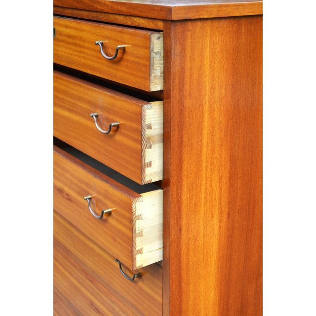 Highboy chest of Drawers, Made in Denmark, attributed to Peter Hvidt A beautifully simple and rare vintage Danish chest of...