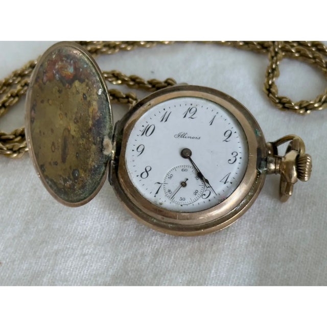 An antique late Victorian ladies’ guard chain and Illinois pocket watch ensemble, circa 1890–1900. The double rope guard...