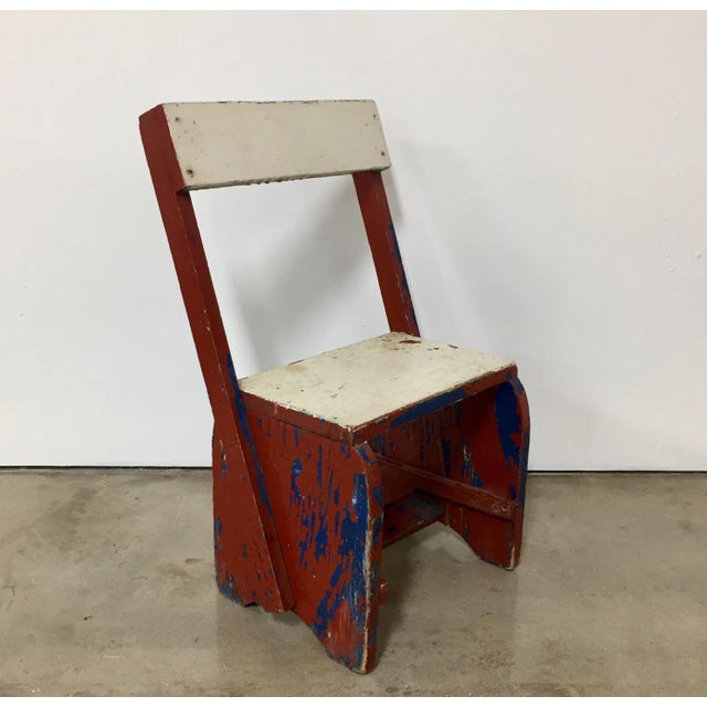 Vintage red, blue, and white child’s chair with great lines and color in the De Stijl design style. The piece is from the...