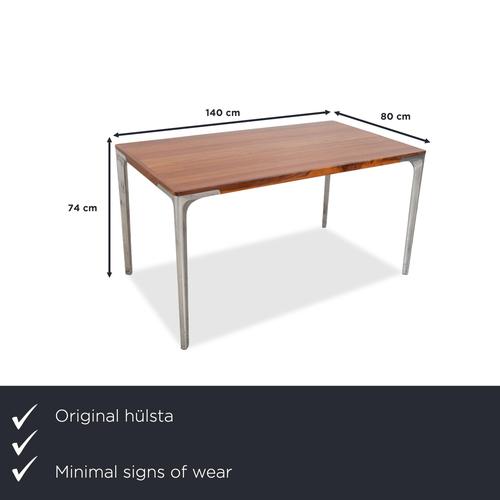 The Hülsta T70 wooden dining table in brown impresses with its high-quality materials and timelessly elegant design. The...