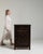 A side cabinet whose black ebonized wood, single drawer, open door gives it real character at first glance. It was made in...