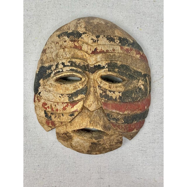 Wonderful vintage African mask. Made of wood with a painted design. Loads of age and wear- which in my opinion add to the...