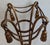 A striking vintage Hollywood Regency gilded iron fern stand featuring elegant rope swag and tassel detailing. Beautifully...