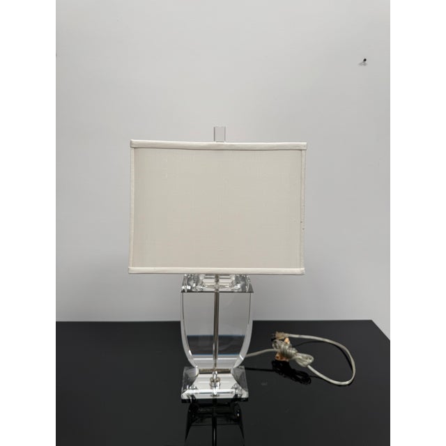 Urn shaped lamp made from solid crystal. Drilled through the center for the cord and finished with polished nickel metal...