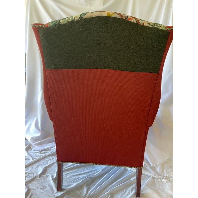 Beautiful wing back chair reupholstered in a Baker fabric hunt scene printed in England with a Clarence House green velvet...