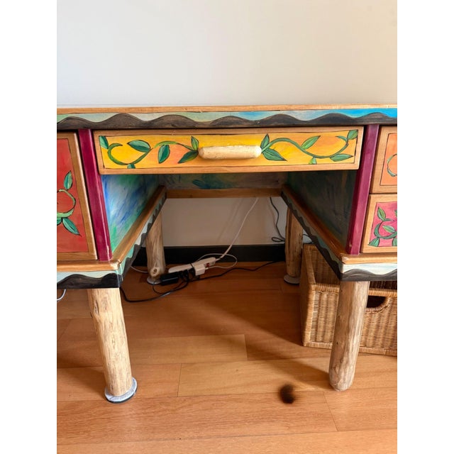 One-of-a-kind large custom desk by Sticks Handmade. Desk features hand drawn burned and painted wood in a variety of...