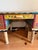 One-of-a-kind large custom desk by Sticks Handmade. Desk features hand drawn burned and painted wood in a variety of...