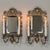 Pair of 19th Century Italian Renaissance Cast Bronze Mirrored Wall Sconces recall the days before electric lighting, when...