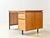 A compact mid-century modern desk, swiss-made by merz roller in the 1960s. The tabletop features a greenish linoleum...