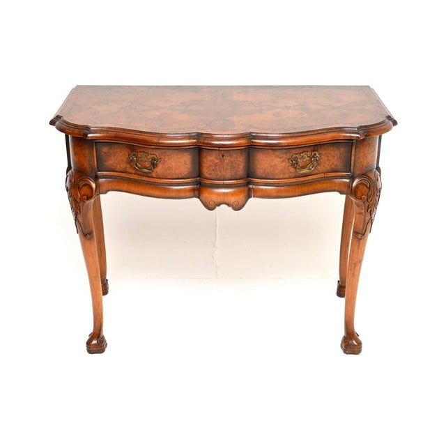 A beautiful and impressive antique burr walnut console / side table by Beresford and Hicks, made in England and dating...