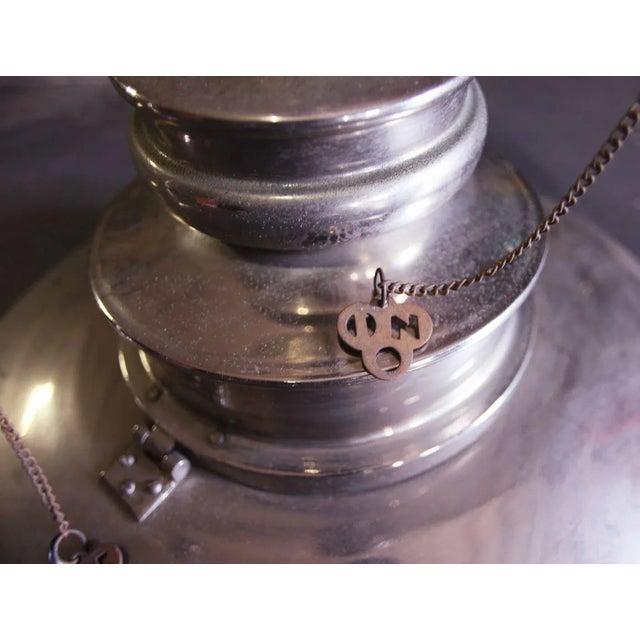 Late 20th century, Mid Century style ceiling fixture with 'on' and 'off' pull chains. Nickel plated and chrome. Two...