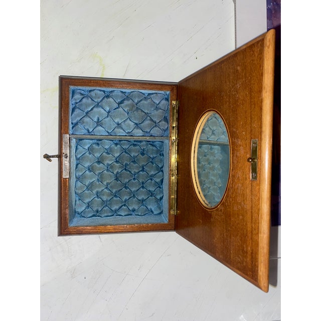 Antique Marquetry Music Box Inlaid Wood Musical Casket Late 19th to Early 20th Century This elegant wooden music box is a...