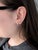 Make a statement with these velvety violet-blue Tanzanite stud earrings, set in solid 14K Yellow Gold. Each earring...