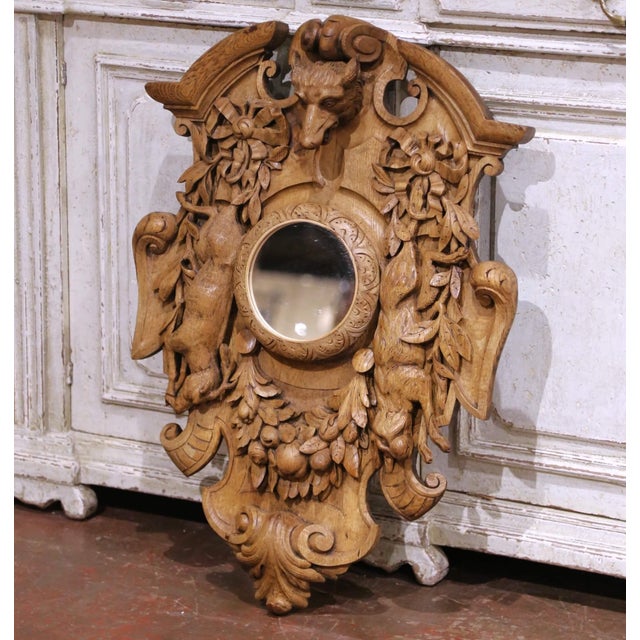 Bring bold Alpine character to a study, library, or lodge-inspired interior with this richly sculpted antique Black Forest...