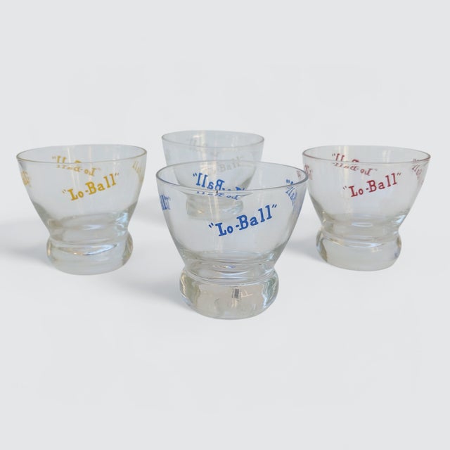 A Set of 4 Pop Art Style Typography Low Ball Glass Tumblers in Red, Yellow, Blue, and White Lettering The perfect set of...