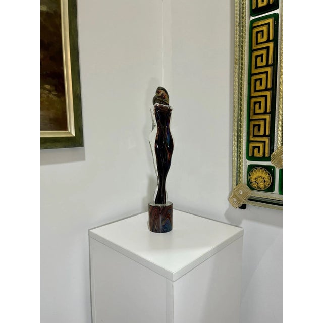 Nice statue created by one of Murano's top Glass Masters. Features calcedonia style glass which creates beautiful...