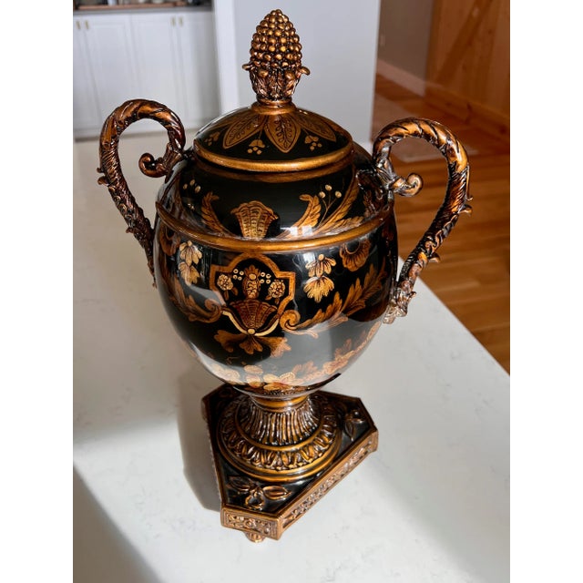 Elegant Timeless Black and Gold Ornate Traditional Grecian Urn, 17" Tall Size: Approx 17”H x 11”W x 9”D Color: Black with...