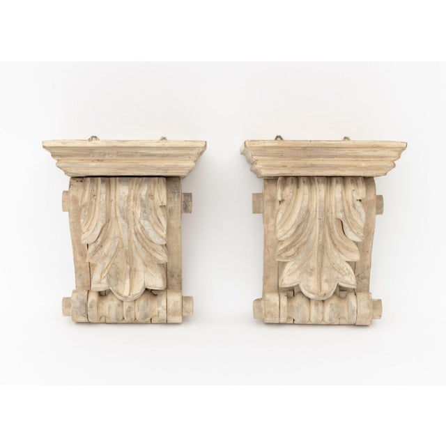 Pair of Neoclassical Carved Wood Wall Brackets, cream painted with acanthus leaf motif. 10" H x 8.5" W x 6.25" D....