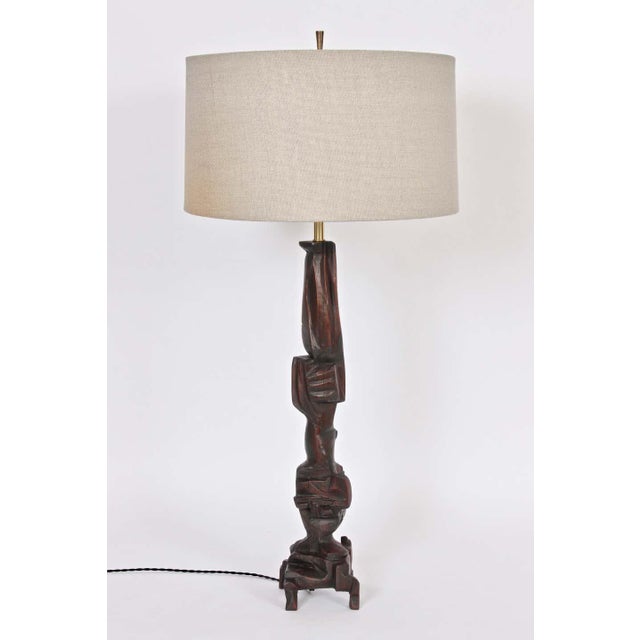 Monumental handcrafted asymmetric Poplar table lamp by New York artist, Smokey Tunis.Featuring a hand carved sculptural...