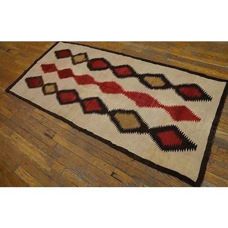1930s American Navajo Rug ( 2'10" x 6'4" - 86 x 193 ) This wonkily woven Native American small long rug shows an ecru...