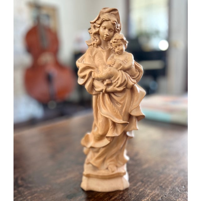 Imported from Germany. Hand carved wood Madonna and Child figurine. Beautifully detailed with flowing design from the...