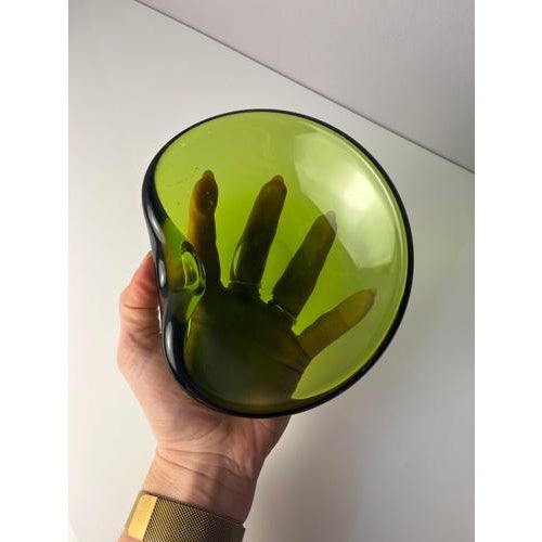 This heavy glass ashtray by Holmegaard is a true Danish design classic and a prime example of high-quality glassmaking...