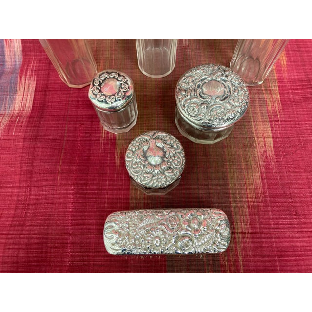 A turn of the century assortment of 7 beautiful jars and a brush for your dressing table or travel kit. These crystal jars...